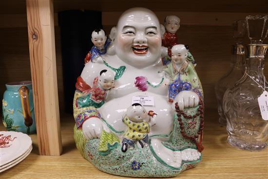 A Chinese enamelled porcelain figure of Budai with attendants height 30cm